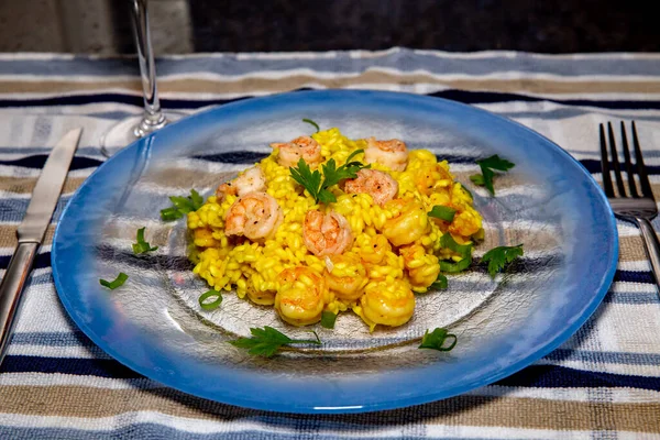 Traditional Italian-style shrimp risotto. Authentic shrimp risotto with saffron. Portrait