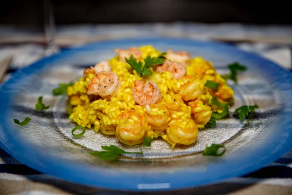 Traditional Italian-style shrimp risotto. Authentic shrimp risotto with saffron. Selective focus