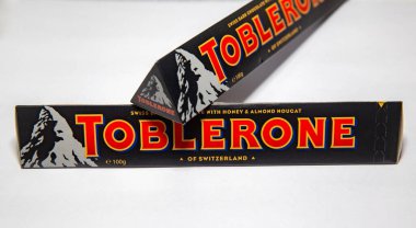 Traditional dark toblerone chocolate isolated in selective focus