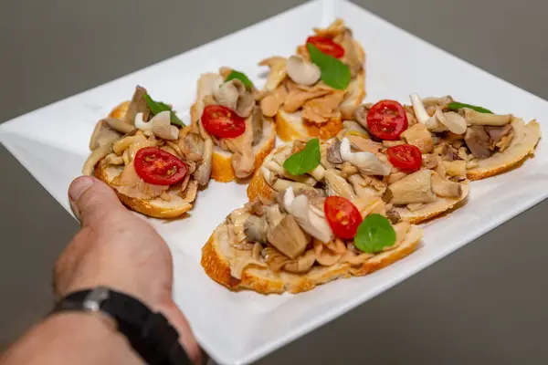 stock image Traditional mushroom burschetta with tomato and basil