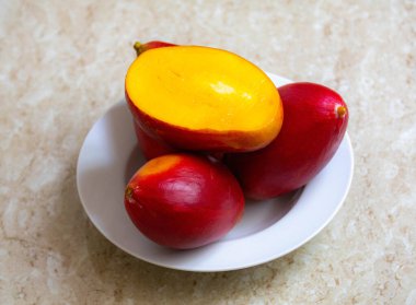 Brazilian mangoes of the Palmer species, ripe and isolated clipart