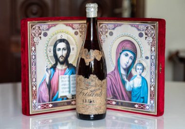  Old family heirlooms, very old Alba sparkling wine and Catholic religious icons clipart