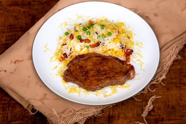 Authentic Brazilian food, grilled picanha steak with birobiro rice clipart