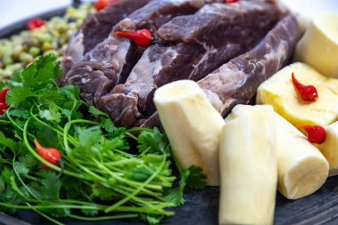 Traditional rustic tropical Brazilian dish, sun-dried beef with green beans, cassava, biquinho pepper. Creative rustic photography clipart