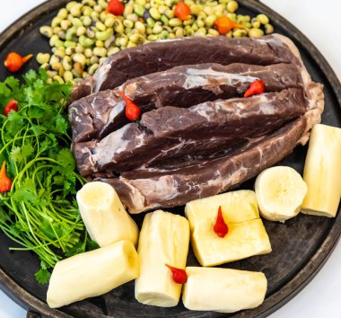 Traditional rustic tropical Brazilian dish, sun-dried beef with green beans, cassava, biquinho pepper. Creative rustic photography clipart