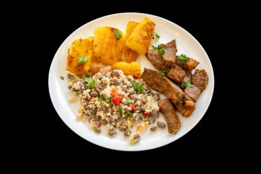 Traditional rustic tropical Brazilian dish, sun-dried beef with green beans, cassava, biquinho pepper. Creative rustic photography clipart