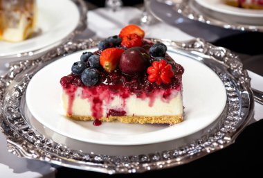 Traditional red fruit cheesecake with creative and luxurious decoration clipart