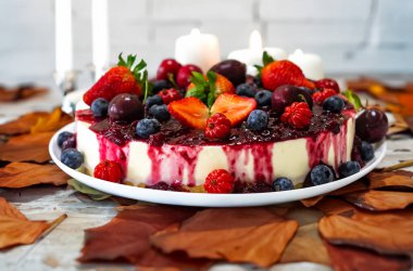 Traditional Christmas red fruit cheesecake with creative and luxurious decoration clipart