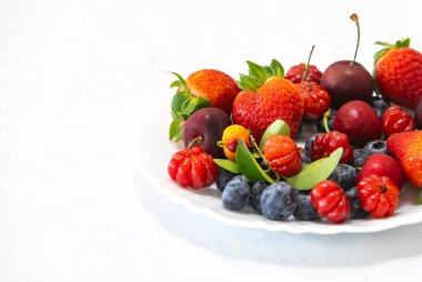 Assorted red fruits, strawberries, blueberries, pitanga, cherries clipart