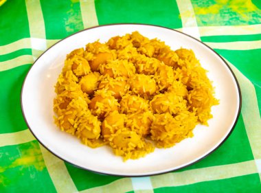 Traditional Brazilian dish chicken with pequi (caryocar brasiliense) and rice clipart