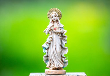 Ancient Catholic sculpture image of Our Lady mother of Jesus clipart