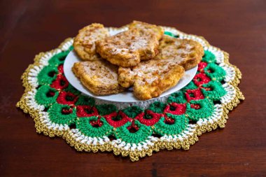 Traditional sweet Christmas French toast served with cinnamon sugar in a Christmas setting clipart