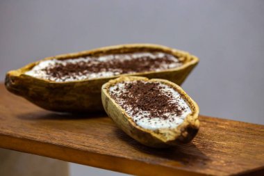  Traditional cupuau cream, cupuau mousse served in the fruit shell with grated chocolate clipart