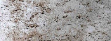 Karmaşık damarları ve desenleri olan cilalanmış mermer taş bir yüzeye yakın çekim