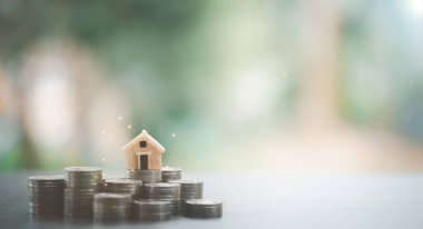 model house on pile of coins,home saving concept,financial and banking,fund growth and savings