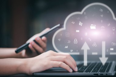 Cloud technology concept and back up privacy database through highly secure communication network, woman using laptop to manage wireless internet data system on storage.