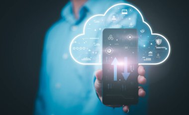 The smartphone in the hands of a young businessman uses cloud network technology to communicate and connect to data servers around the world. with online internet innovation,cloud computing