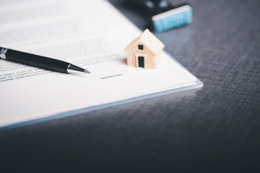 Concept of signing contract documents and making business agreements, acceptance and approval through legal form documents, business contract agreement documents, papers and pens placed on the table.