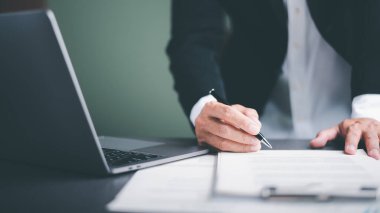 Businessman validates and manages business documents and agreements. , signing a business contract approval of contract documents confirmation or warranty certificate