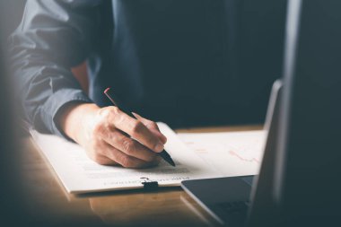 Businessman validates and manages business documents and agreements. , signing a business contract approval of contract documents confirmation or warranty certificate,employment idea, project review