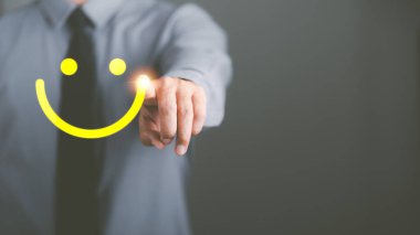 The concept of optimism, positive thinking, changing attitudes is a mental and emotional development to inspire goals to be achieved, businessmen pointing at the icon smiling confidently