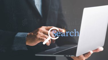 Keyword search technology concept to find information from online websites. website link search and computer communication networks web browser browsing,businessman touching laptop
