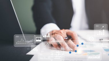 business people analyze data in marketing white paper with statistics from charts and graphs Management of business documents and financial and investment strategies. business growth consulting