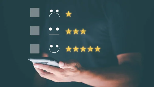 Male consumers use smartphones to assess their satisfaction and to rate and review online. Customer Experience Survey Concepts for Services and Products and Customer Engagement