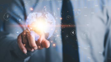Businessman pointing at virtual icons, currency exchange concept, investment in financial forex, Investing in the stock market of cryptocurrencies, investment financial concept.