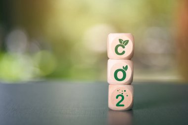 Industrial emissions pollute the environment and ecology. including climate change ,Carbon Reduction Agreement from Renewable Energy Reduce greenhouse gas emissions,wooden cubes arranged on the table