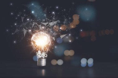the light bulb is on the table,for Concept new idea, concept with innovation and inspiration, innovative technology in science concept and modern business development,creative idea.