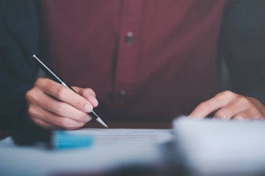 Businessman validates and manages business documents and agreements. , signing a business contract approval of contract documents confirmation or warranty certificate,employment idea, project review