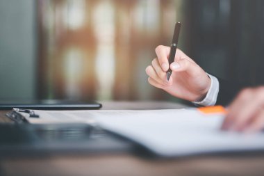 Businessman validates and manages business documents and agreements. , signing a business contract approval of contract documents confirmation or warranty certificate,employment idea, project review