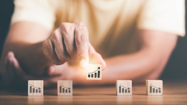 Businessman showing business growth and success graph ,concept of progress in development, financial efficiency and investment with business strategy for goals and opportunities in the industry future	