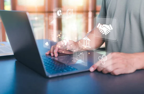 Business people work through laptops, virtual icons representing big data concepts, cyberspace technology and internet network databases, innovative connections and communications around the world.
