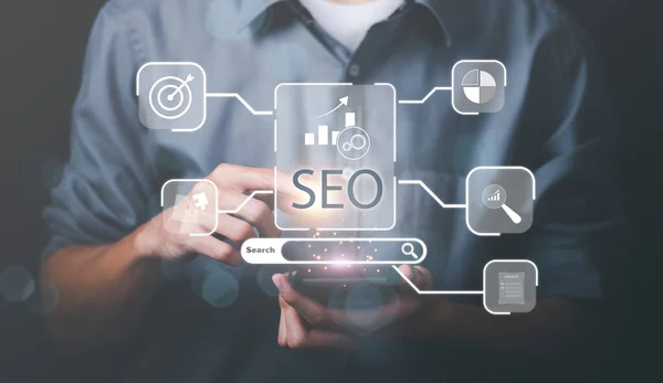 Marketer showing SEO concept through virtual icons , optimization analysis tools, search engine rankings, social media sites based on results analysis data ,Website rankings for best results