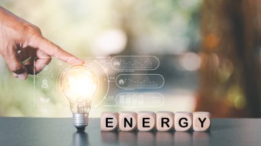 protecting the environment alternative energy Sustainable renewable energy sources Green energy innovation and environmentally friendly energy technology,hand pointing at light bulb