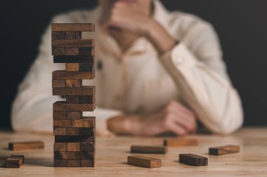 A wooden jenga box placed on the table,Financial risk management and strategic planning through data analysis for continuous improvement Visionary Decisions for Leadership Succes