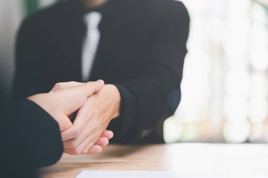 Businessmen shaking hands to indicate a business deal,successful contract management of the company,signing an agreement,business partner,New opportunities for the future of the industry,joint venture