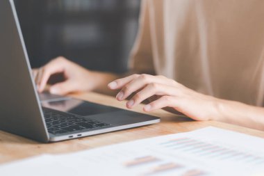 Business people read business statistics chart reports, to analyze and improve corporate strategy, manage financial and marketing documents, update annual budget accounts, company growth data.	