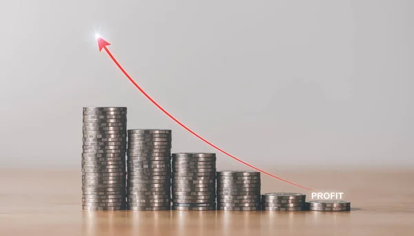 pile of coins and a graph showing an increase in profits,and  business growth,concept of progress in development financial performance and investment,with business strategies for future goals