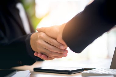 Businessmen shaking hands to indicate a business deal,successful contract management of the company,signing an agreement,business partner,New opportunities for the future of the industry,joint venture