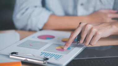 data analyst read business statistics chart reports, to analyze and improve corporate strategy, manage financial and marketing documents, update annual budget accounts, company growth data.