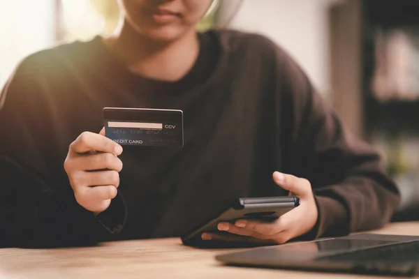 Consumers hold credit cards ,Shopping concept, online web shopping and home delivery service, connects merchants and customers worldwide, online payment, consumer society, cashless society