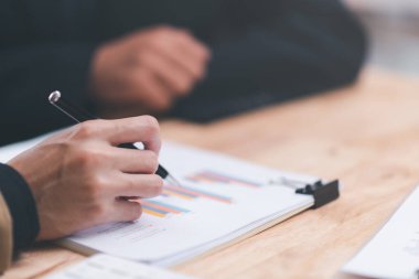 business people analyzing chart report and business growth statistics, Analysis and improvement of corporate strategy Manage financial and marketing documents Adjust the annual budget account.