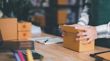 Startups or Small Business Entrepreneurs, Pack products for delivery, manage orders in online stores, shop online, sell online on the internet, SME ,ecommerce logistics service concept