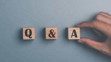 Wooden blocks and human hands ,concepts to find answers ,Question Ask ,getting help in solving problems, Q and A word with wooden cube block ,frequency asked questions
