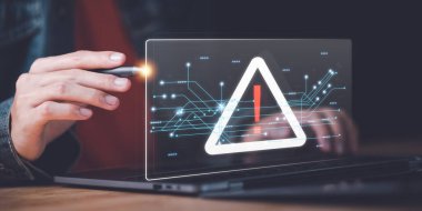 Programmer and virtual icons , exclamation mark ,alarm,computer virus detected ,danger warning concept or information error that should be urgently fixed and repaired ,Notification of security issues 