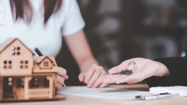 customer checking loan agreement with real estate agent ,Investment loan approval concepts to build residential homes, real estate business ,appraisal of property value ,Signing to approve contract