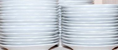 white background of horizontal stripes of stacked plates